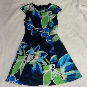 Lovely floral printed dress with leather detail on sleeves and collar